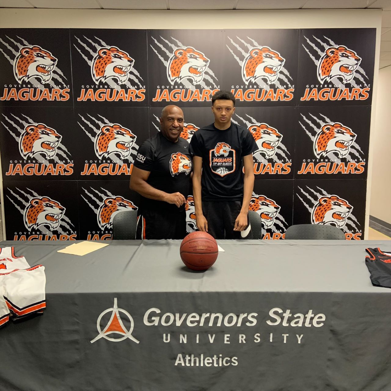 (L-R) Governors State University Head Basketball Coach Tony Bates with men's basketball National Letter of Intent signee Tyrell Isom.