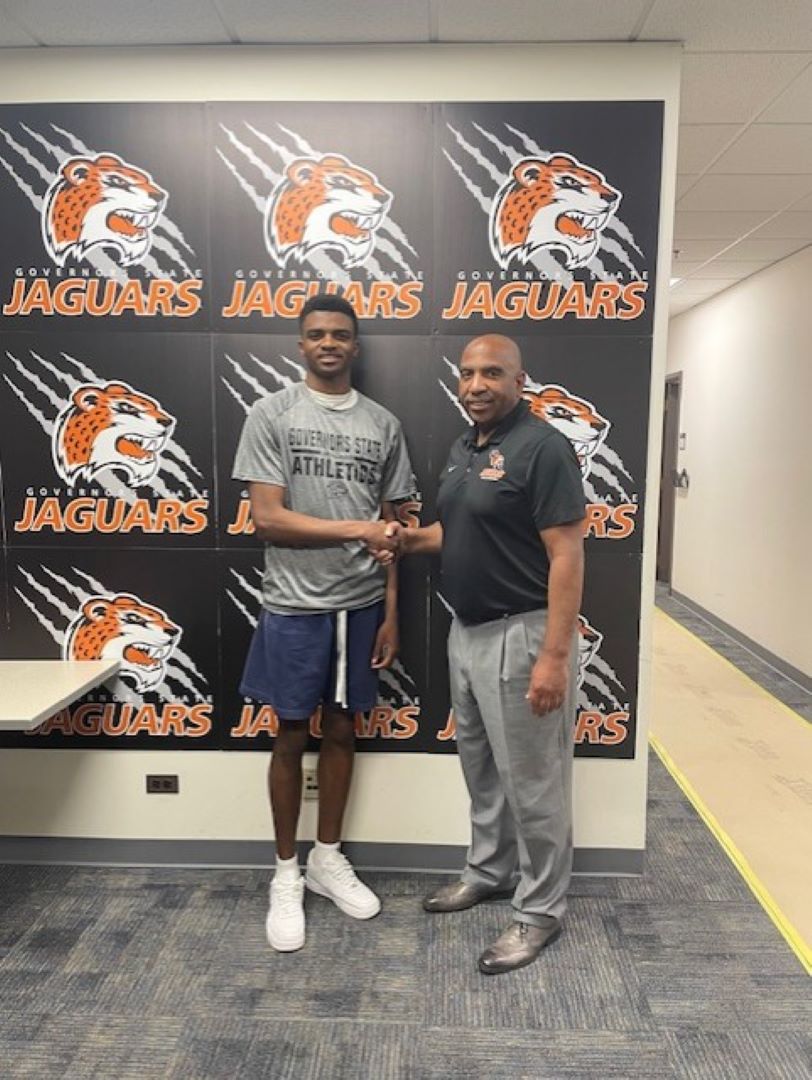 Shane Foster with GSU Men's Basketball Coach Tony Bates on signing day at Governors State University.