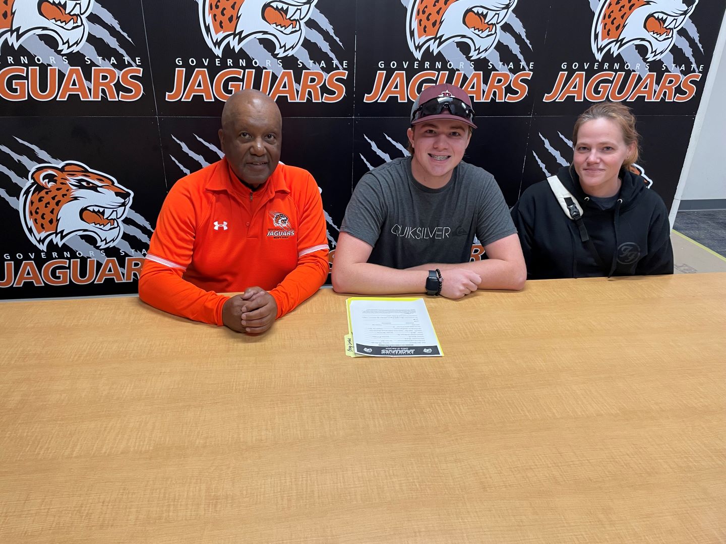 (L-R) GSU Head Golf Coach Fred Hawkins, New Jaguar Golfer Charles Dunford and his Mom Cellie Robinson.