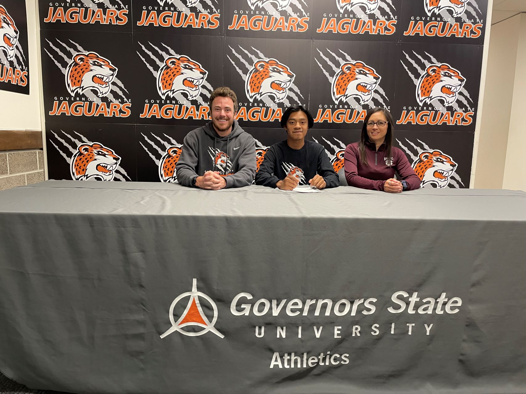 (L-R) GSU Head Coach John Niendorf ,new Jaguar recruit Chris Sacayon and Dupo High School Cross Country Coach Kris Mendoza.