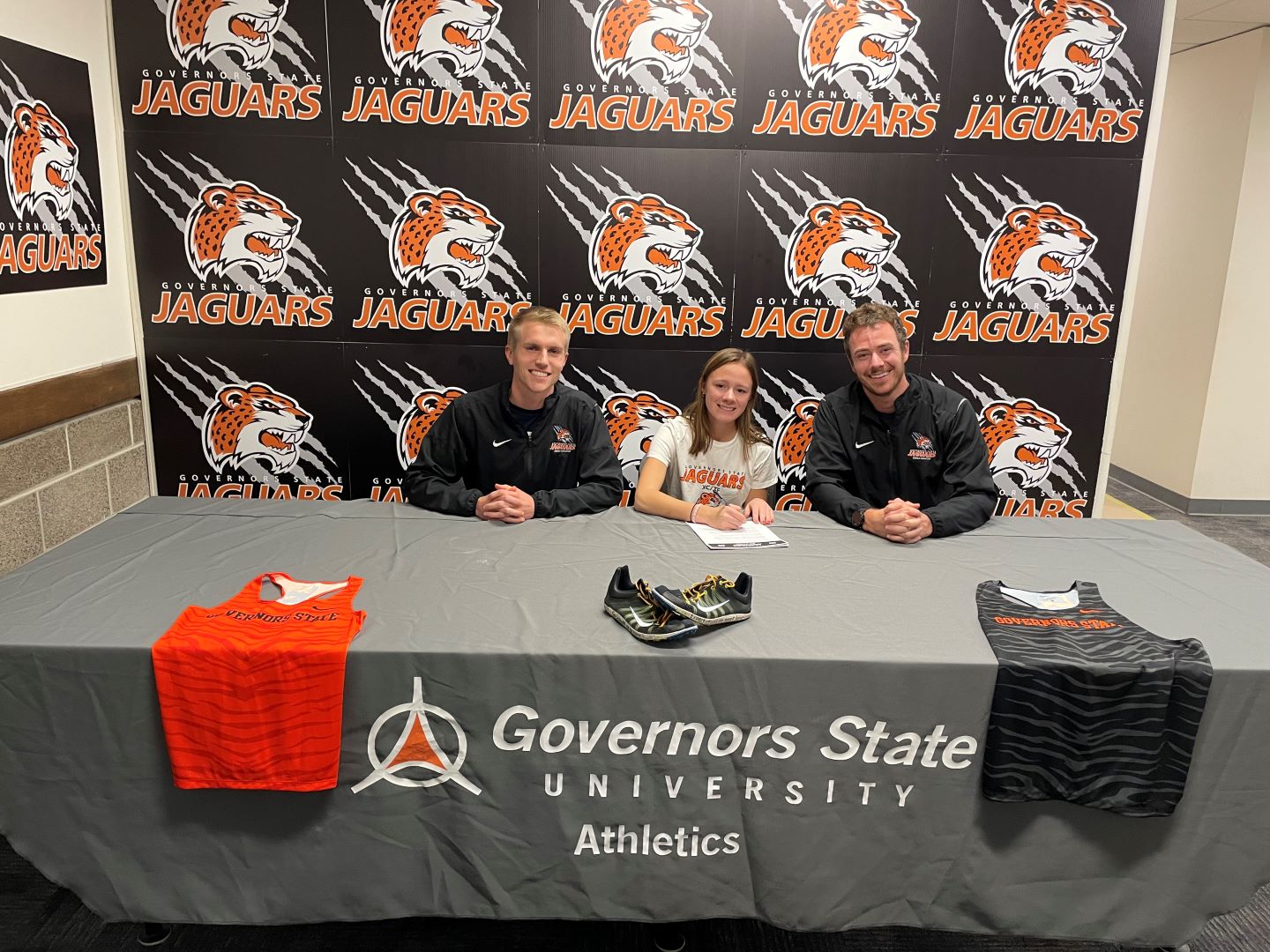 (L-R) - GSU Assistant Coach Lenny Baumann, Kaylee O'Sullivan, GSU Head Coach John Niendorf.