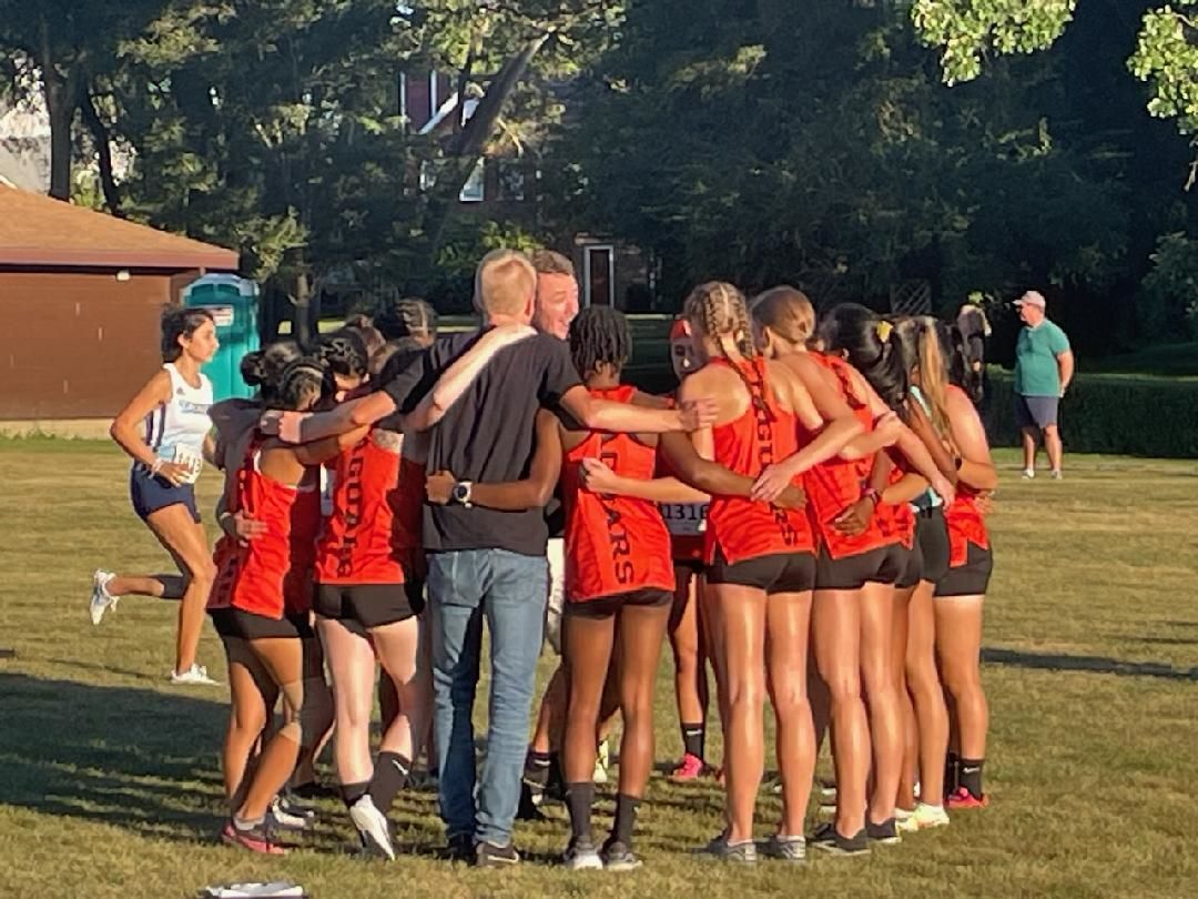 Women's Team Huddle Sept. 1 at Season Opening Meet.